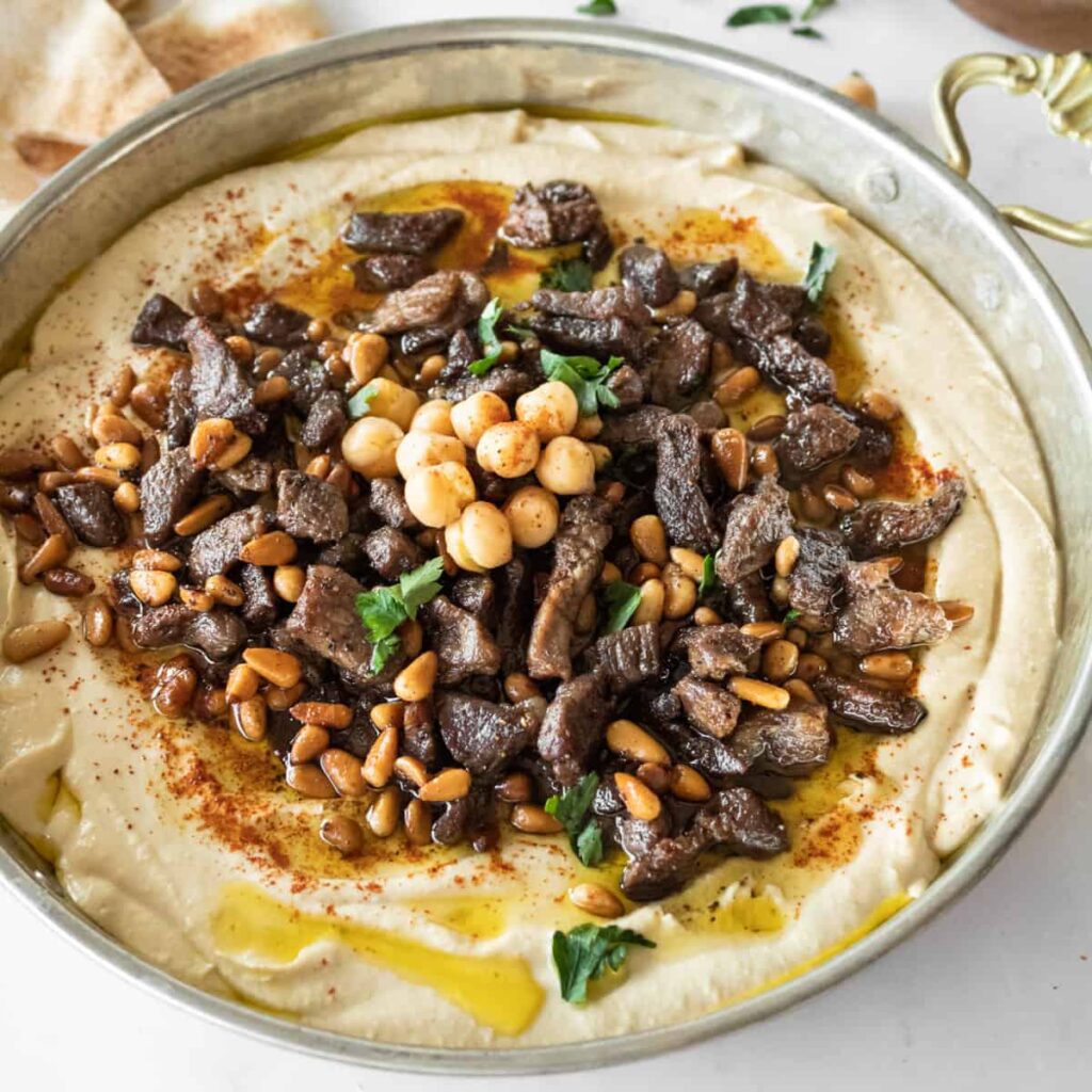 Prime beef hummus topped with tender seasoned beef