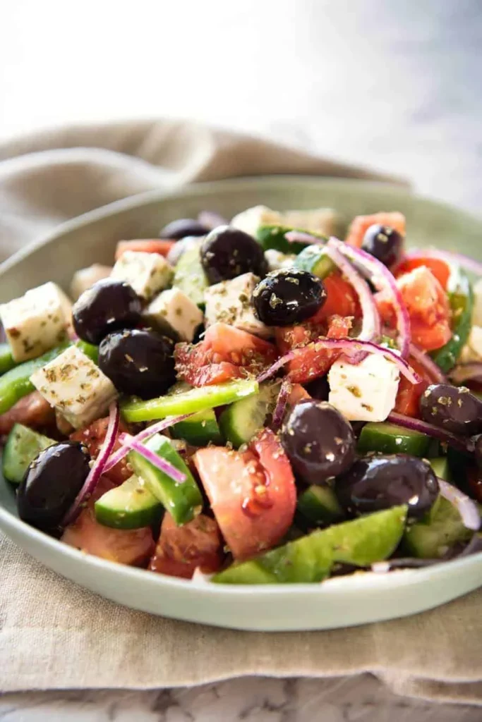 Greek salad with tomatoes cucumbers olives and feta at Mezzaluna Jamaica