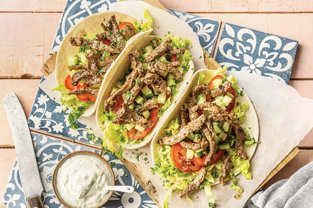 Roasted beef wrap with garlic sauce and vegetables at Mezzaluna Jamaica