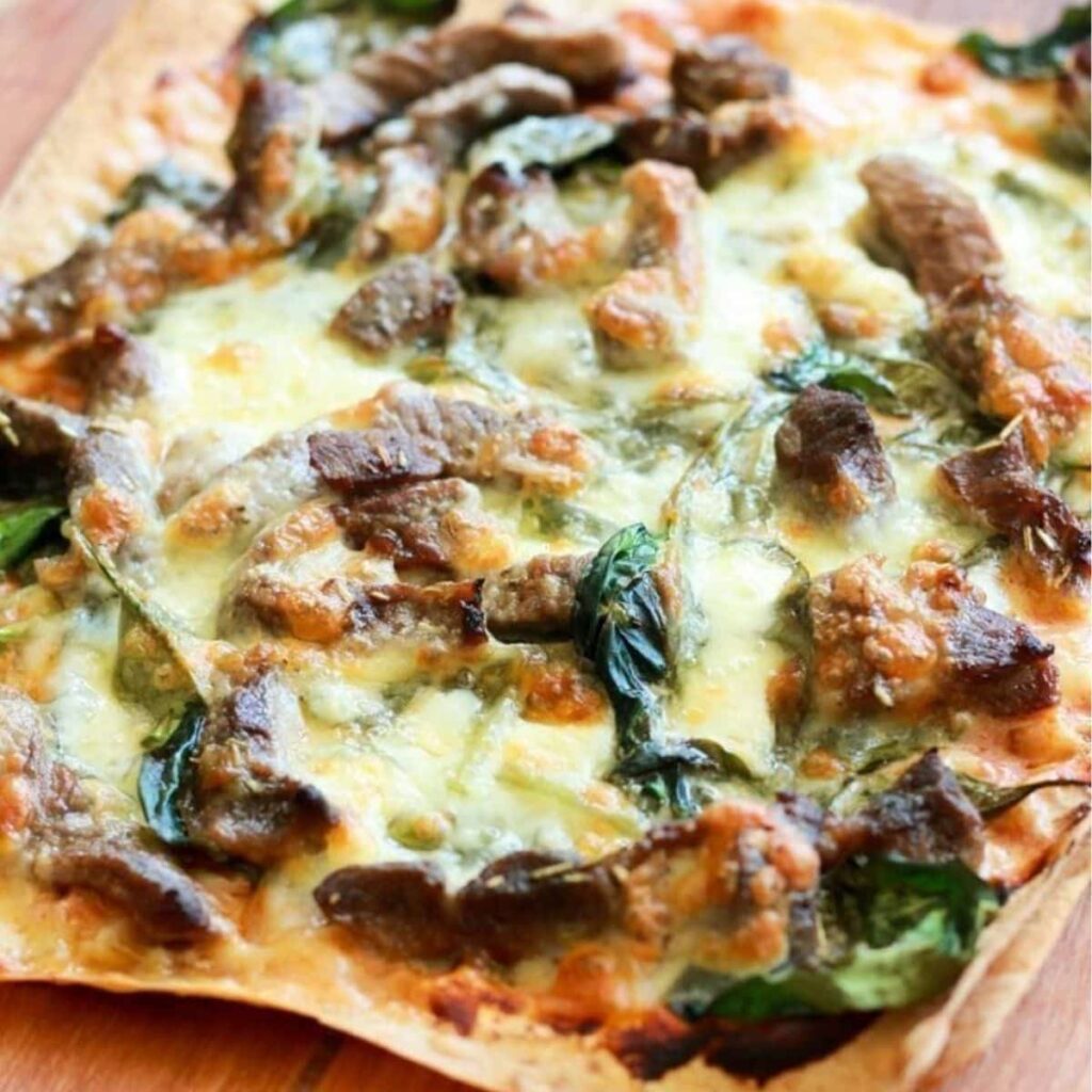 Roasted Garlic and Lamb Kafta Pizza at Mezzaluna Jamaica – Greek-Inspired Flavor