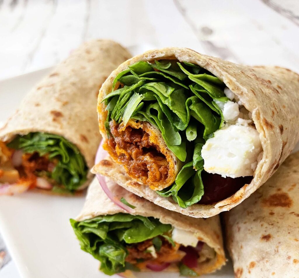 Roasted vegetable wrap with fresh herbs served at Mezzaluna Jamaica